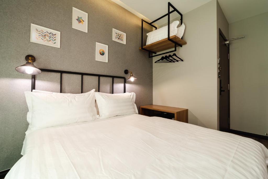 Postel nebo postele na pokoji v ubytování SVOK Hotel