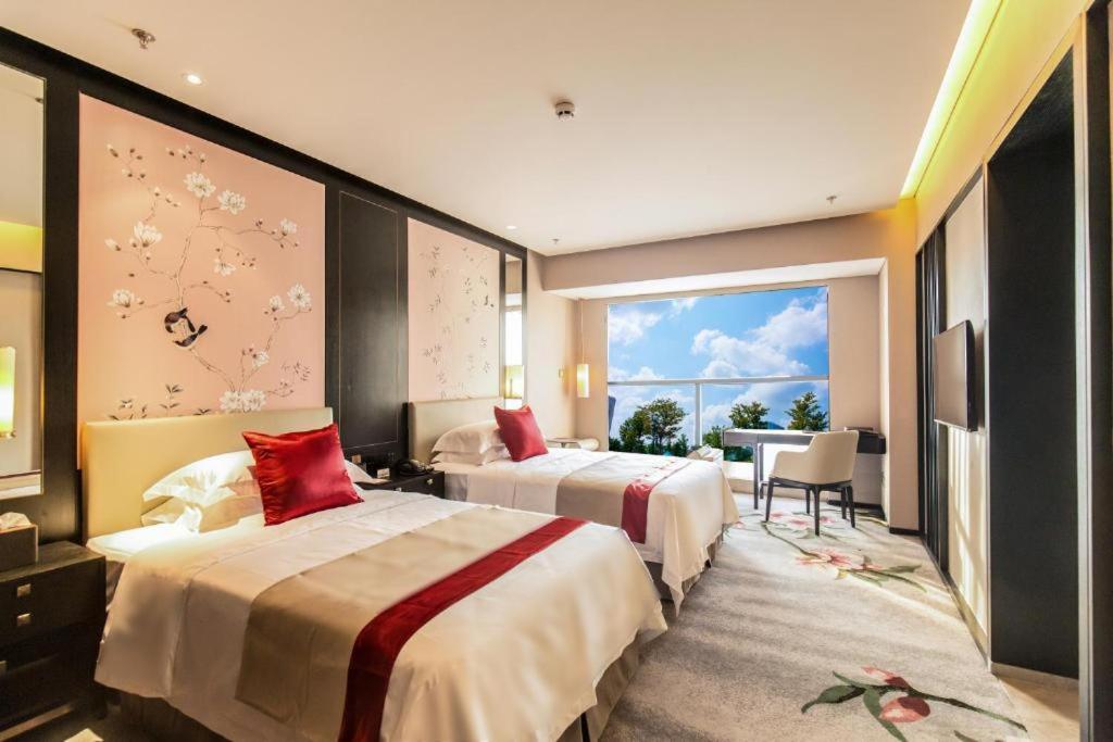 Postel nebo postele na pokoji v ubytování DoubleTree by Hilton Weihai