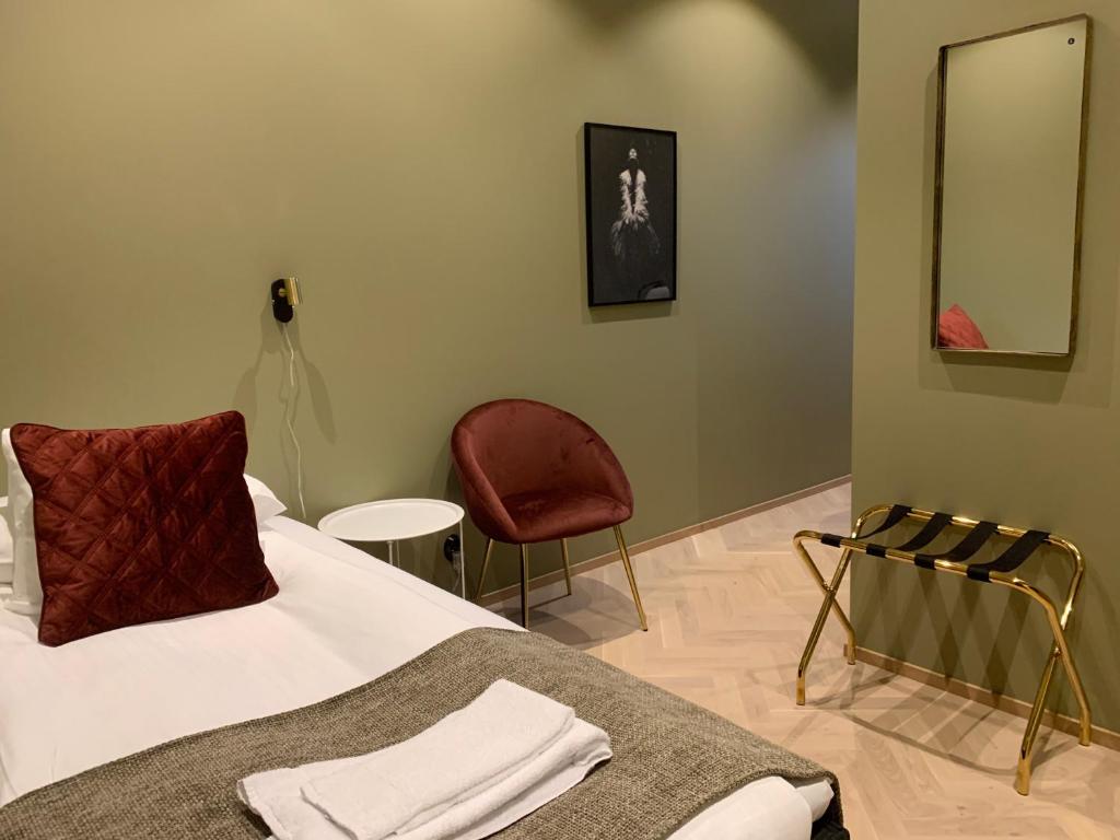 Postel nebo postele na pokoji v ubytování Hotell Esplanad