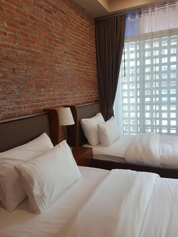 Postel nebo postele na pokoji v ubytování Mon-Dee minihotel