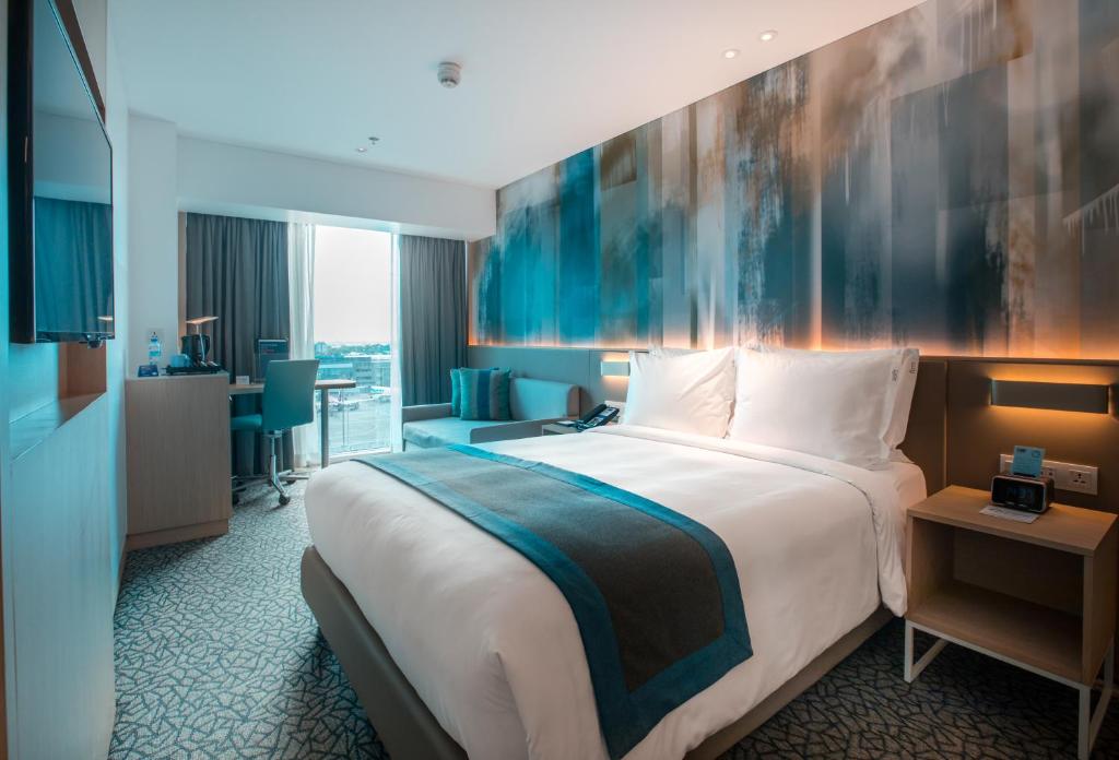 Postel nebo postele na pokoji v ubytování Holiday Inn Express Manila Newport City by IHG