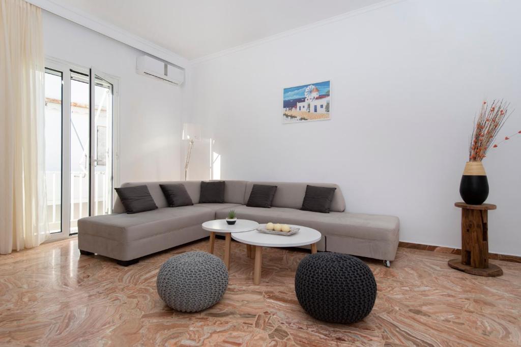 a living room with a couch and a table at Downtown Apartment in Parikia