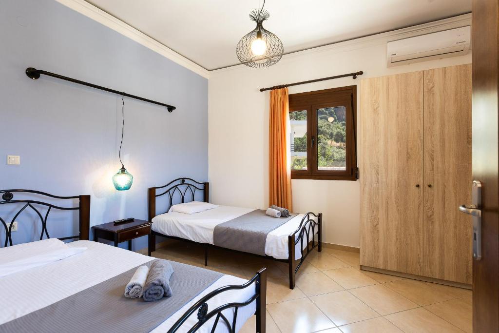 Postel nebo postele na pokoji v ubytování Stefanakos House