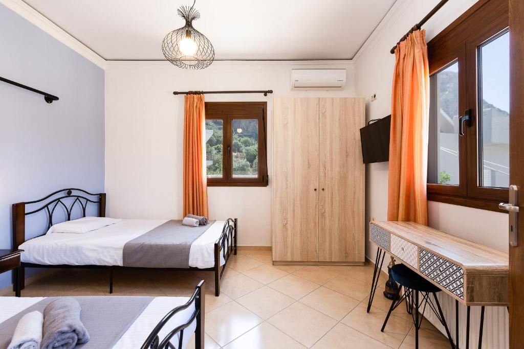 Postel nebo postele na pokoji v ubytování Stefanakos House