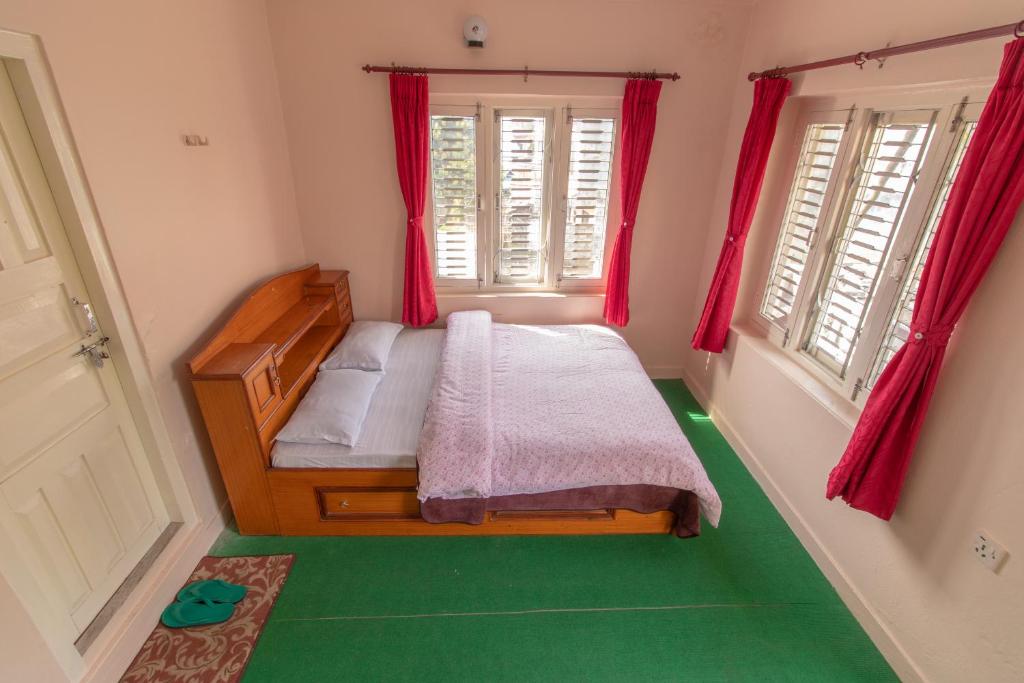 Letto o letti in una camera di New Tourist Guest House