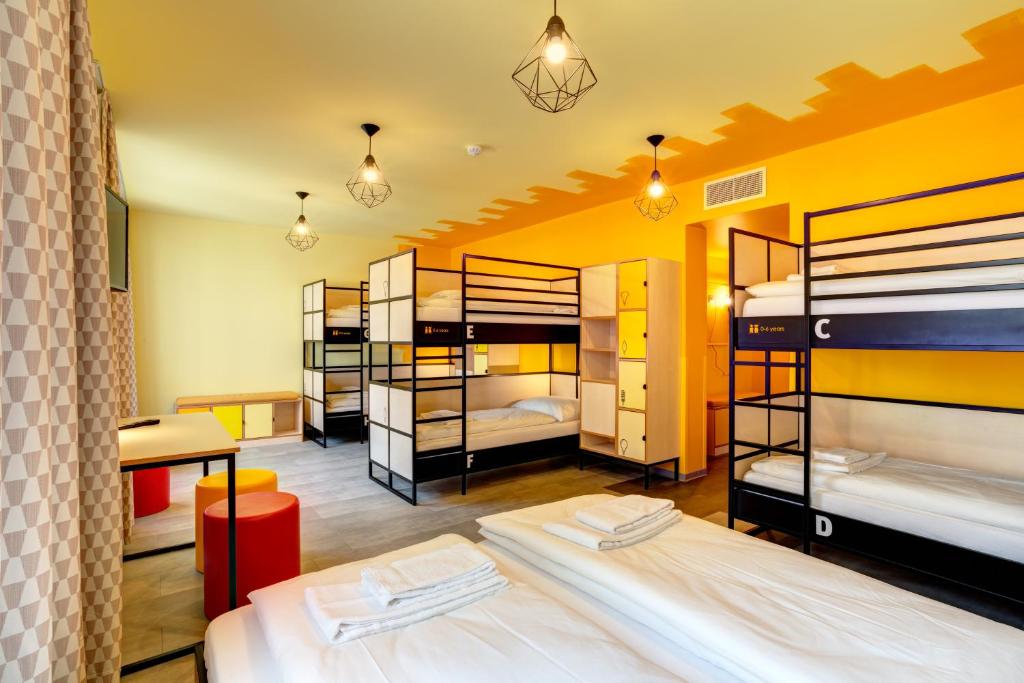Postel nebo postele na pokoji v ubytování MEININGER Hotel Lyon Centre Berthelot