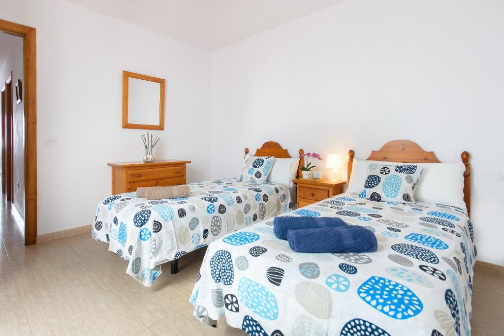 Postel nebo postele na pokoji v ubytování Casa Ancla
