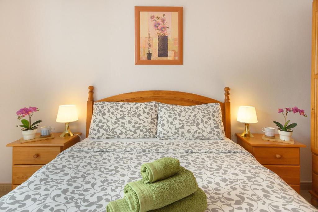 Postel nebo postele na pokoji v ubytování Casa Ancla