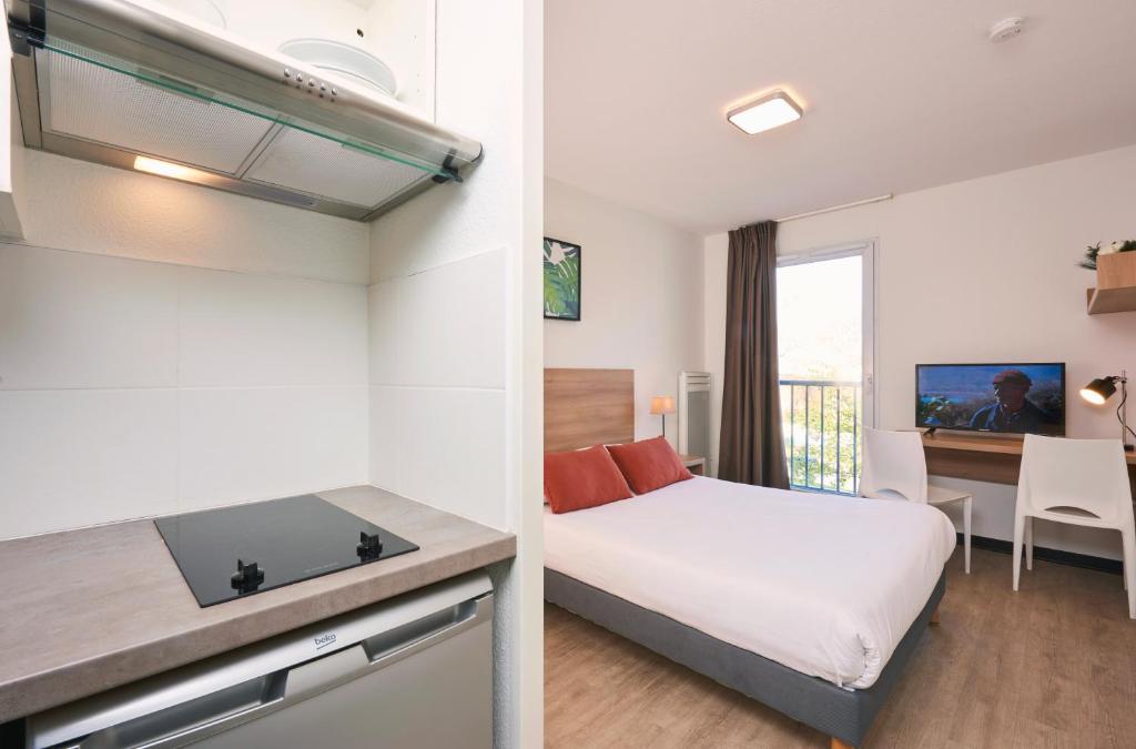 TV a/nebo společenská místnost v ubytování Ténéo Apparthotel Talence - Centre