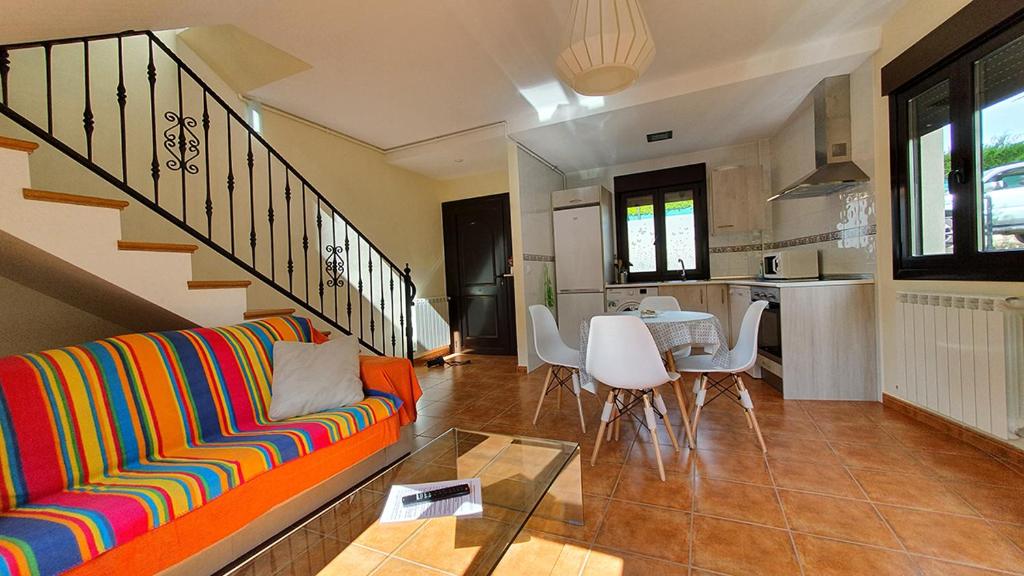 a living room with a couch and a table at Apartamentos Virgen de Tironcillo in Cuzcurrita-Río Tirón