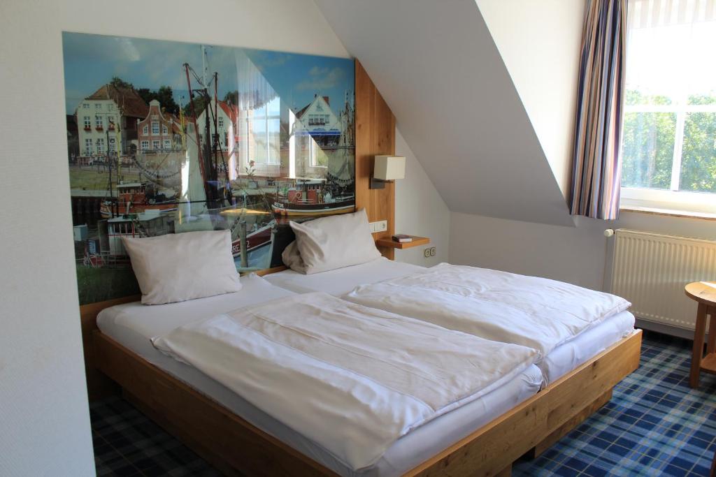 Postel nebo postele na pokoji v ubytování Landhaus Oltmanns