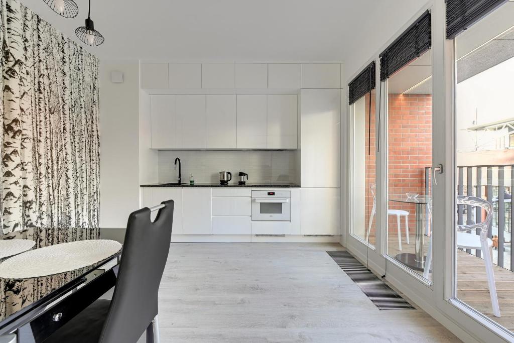 Kuchyň nebo kuchyňský kout v ubytování Comfort Apartments Rajska