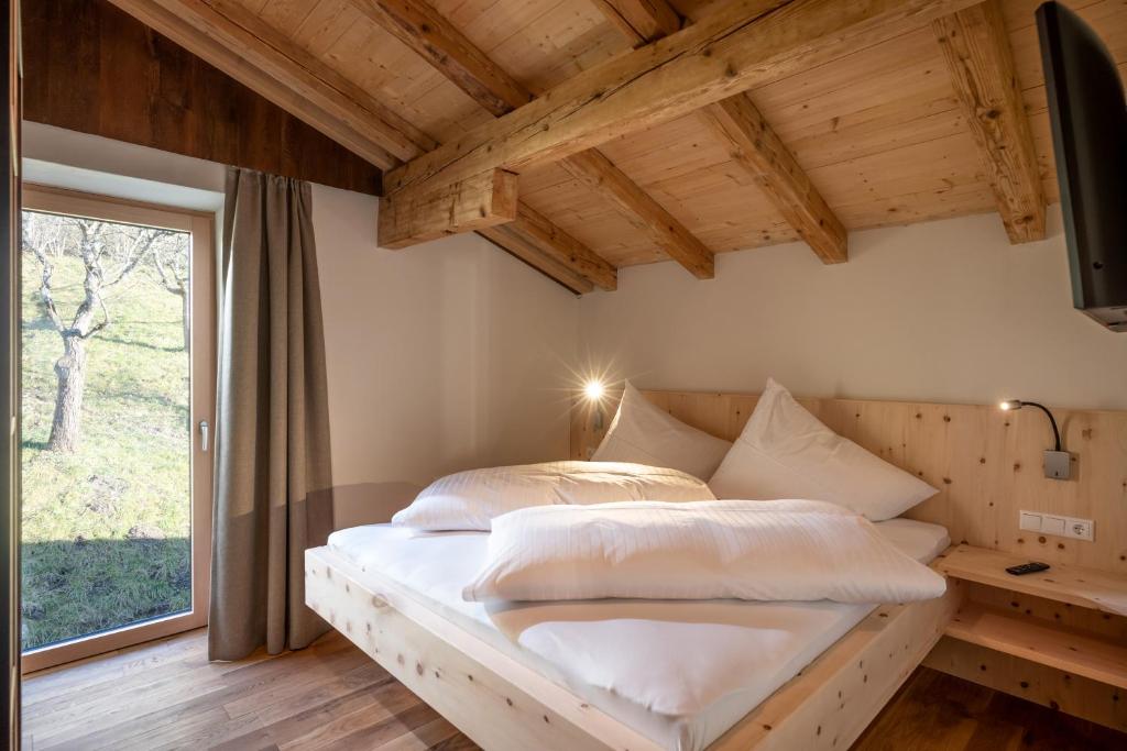 Postel nebo postele na pokoji v ubytování Apartments Zauberberg