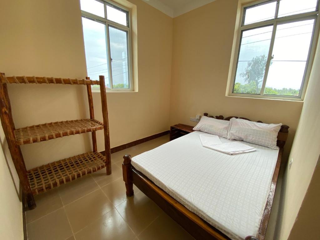 Postel nebo postele na pokoji v ubytování Village View Hostel