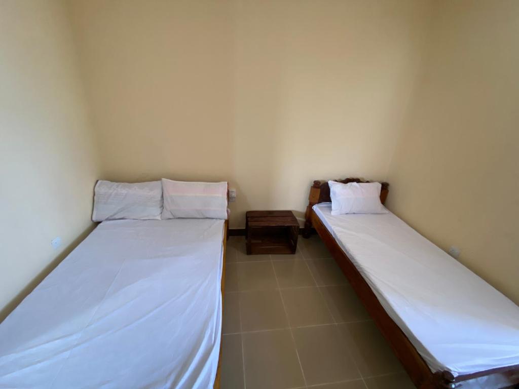 Postel nebo postele na pokoji v ubytování Village View Hostel