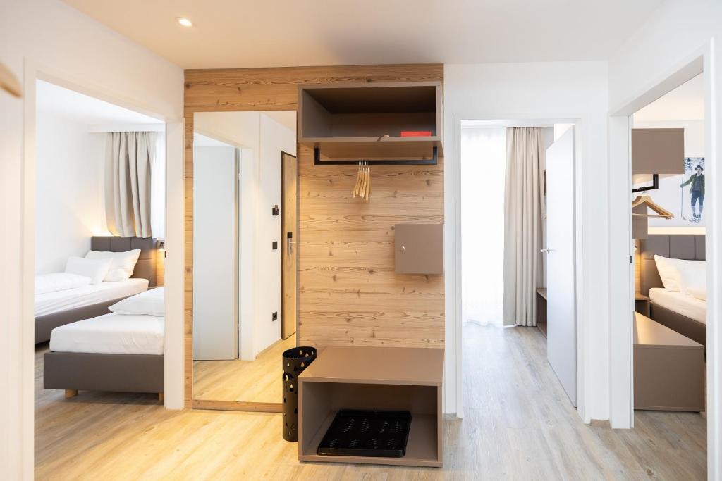 Postel nebo postele na pokoji v ubytování ALPRIMA Aparthotel Hinterstoder