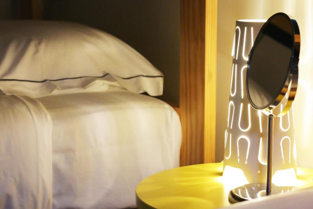 Postel nebo postele na pokoji v ubytování Procyon Boutique & Suites