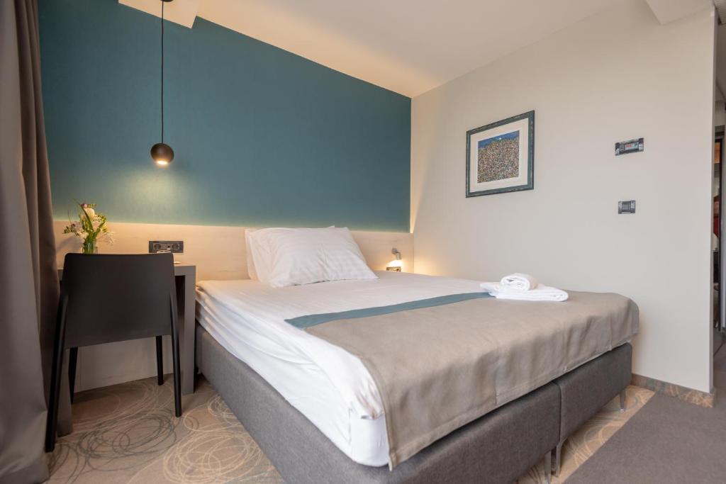 Posteľ alebo postele v izbe v ubytovaní Hotel Kolovare