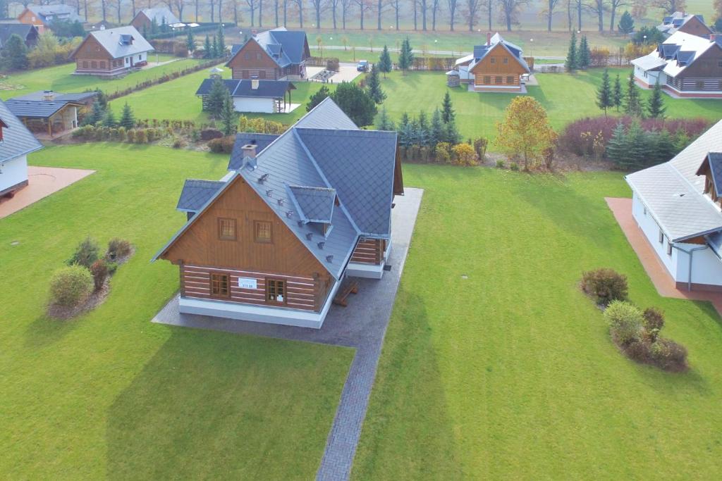 an overhead view of a house on a green field at Chalupa CARLA in Vrchlabí