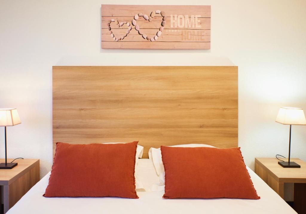 Postel nebo postele na pokoji v ubytování Ténéo Apparthotel Talence - Centre