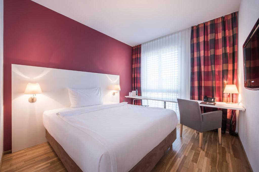 Postel nebo postele na pokoji v ubytování Hotel Arcade