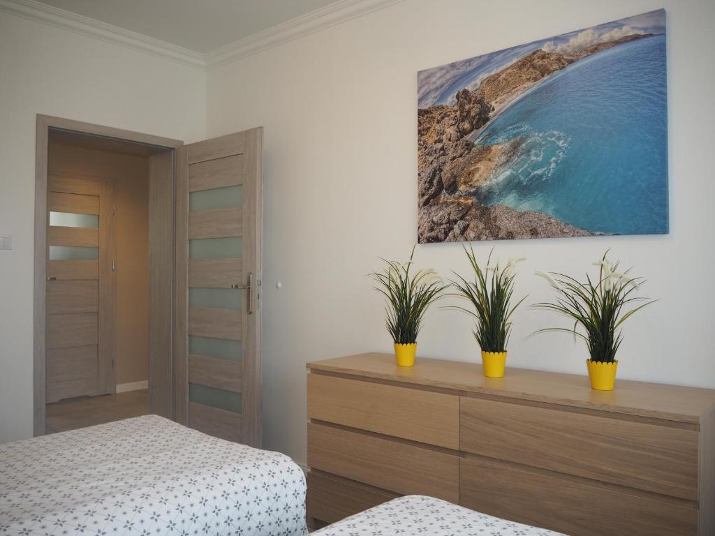 Posteľ alebo postele v izbe v ubytovaní Apartamenty Dobranoc - Wawer 2