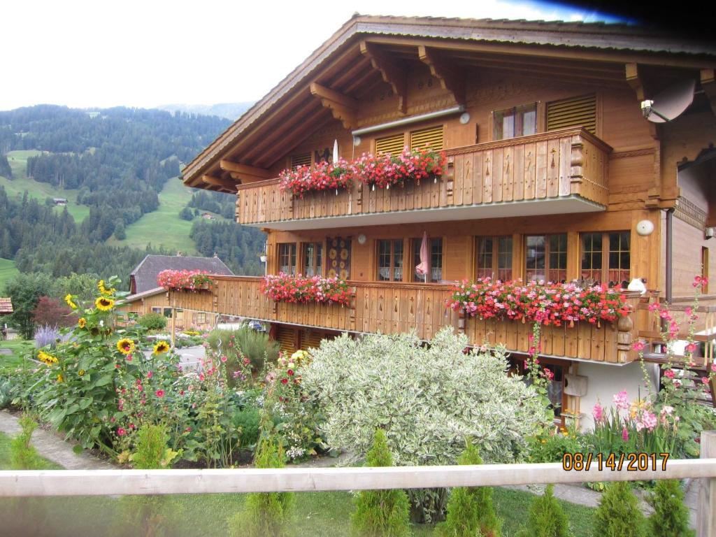 a house with flowers on the side of it at Apartment Morgenstern by Interhome in Sankt Stephan