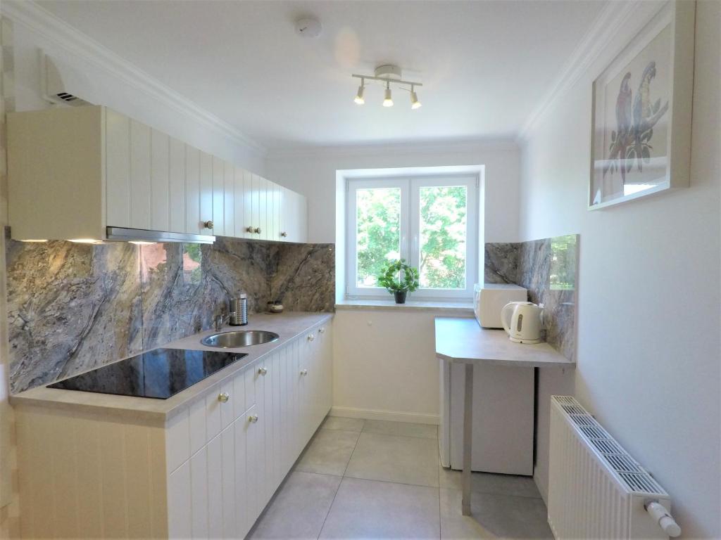 Kuchyňa alebo kuchynka v ubytovaní Apartamenty Dobranoc - Wawer 2