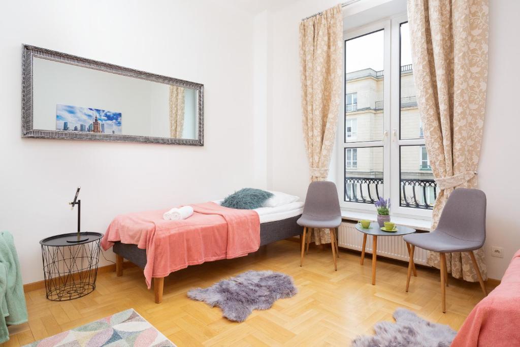 Postel nebo postele na pokoji v ubytování Apartments Warsaw Warecka by Noclegi Renters