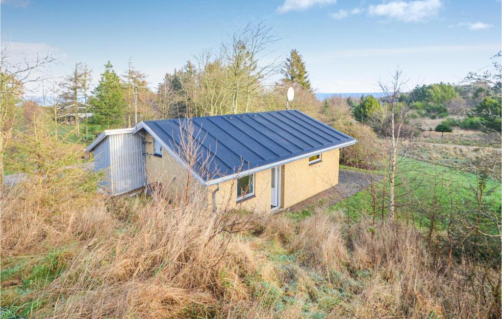 a house with a solar roof on a hill at 2 Bedroom Beautiful Home In Fur in Fur