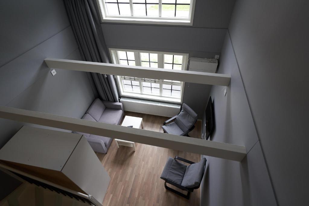 an overhead view of a room with chairs and a window at Ekebyhov Hotell in Ekerö