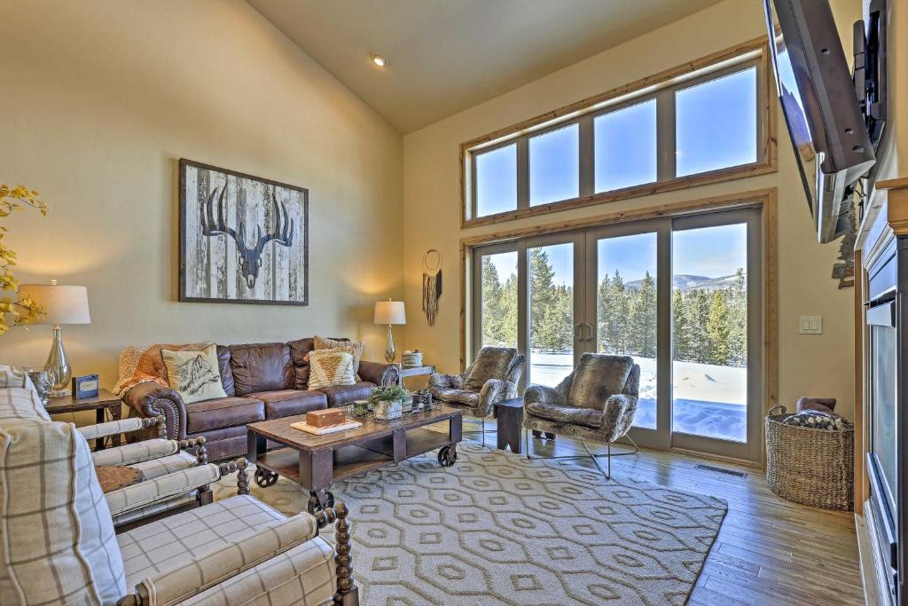 a living room with a couch and a table at Grand Lake Getaway Walk to Shadow Mountain Lake! in Grand Lake