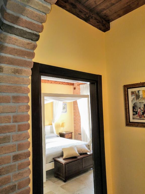 Postel nebo postele na pokoji v ubytování BORGO LUNA b&b