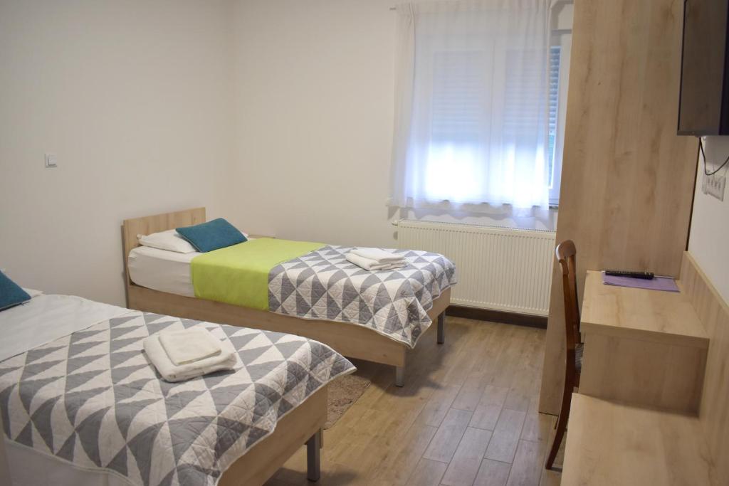 Postel nebo postele na pokoji v ubytování Hotel Fala Zagreb