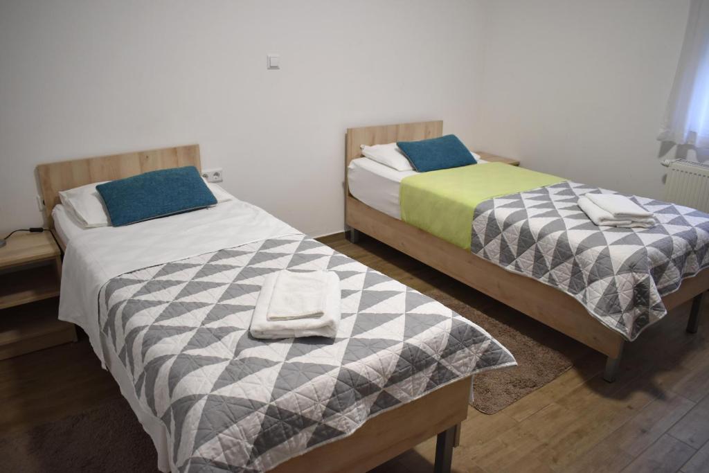 Postel nebo postele na pokoji v ubytování Hotel Fala Zagreb
