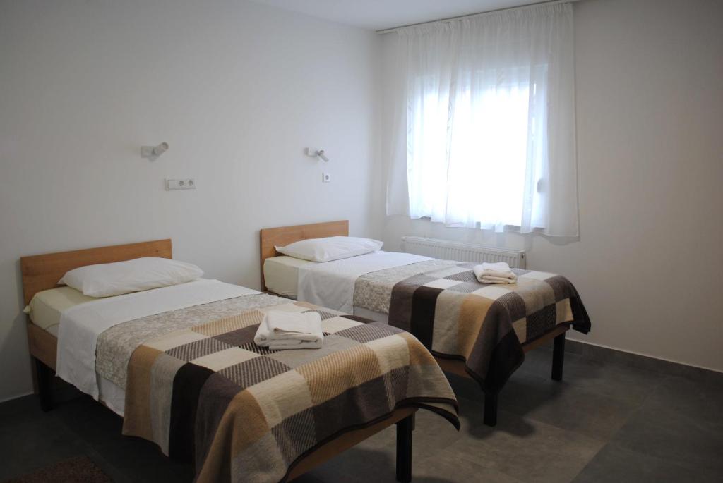 Postel nebo postele na pokoji v ubytování Hotel Fala Zagreb