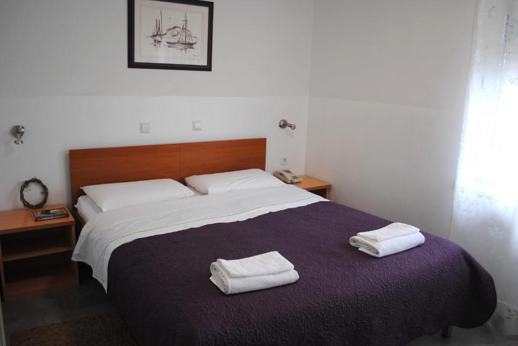 Postel nebo postele na pokoji v ubytování Hotel Fala Zagreb