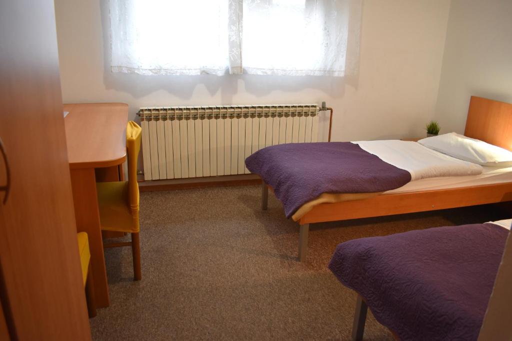 Postel nebo postele na pokoji v ubytování Hotel Fala Zagreb