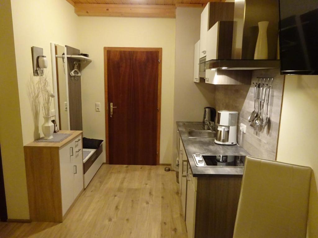 Kuchyň nebo kuchyňský kout v ubytování Apartment zum Wasserfall