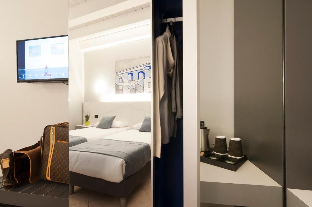 Postel nebo postele na pokoji v ubytování Hotel Fontana Verona