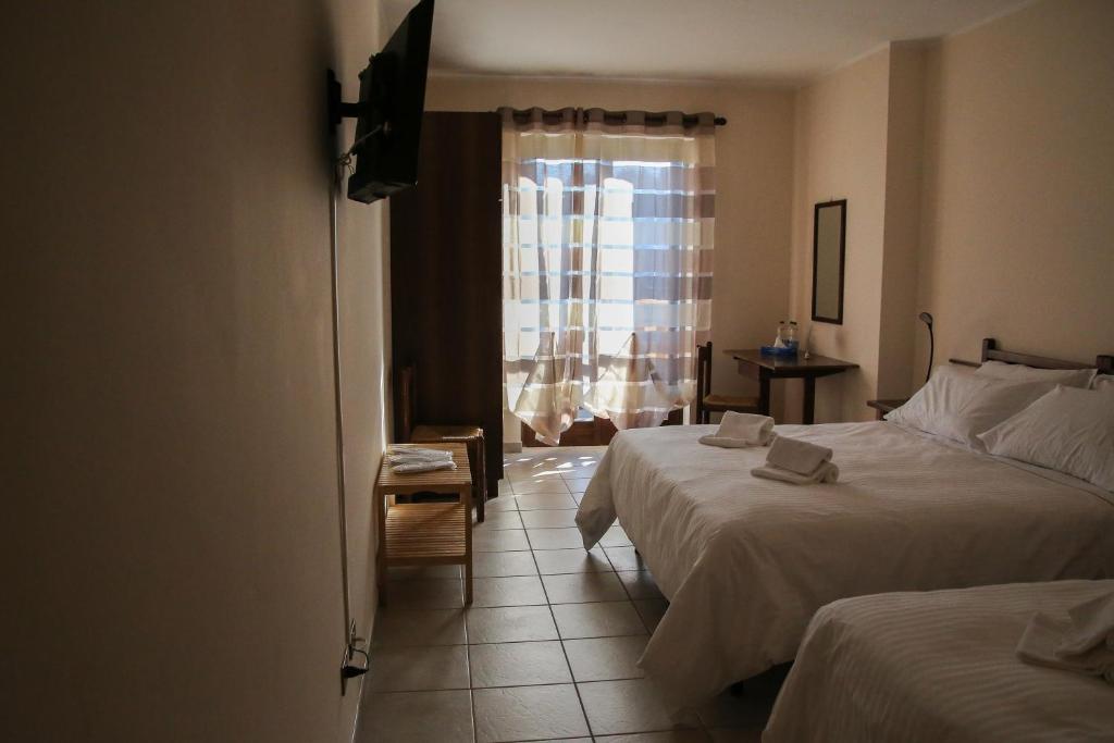 Posteľ alebo postele v izbe v ubytovaní Albergo Parco Gran Sasso