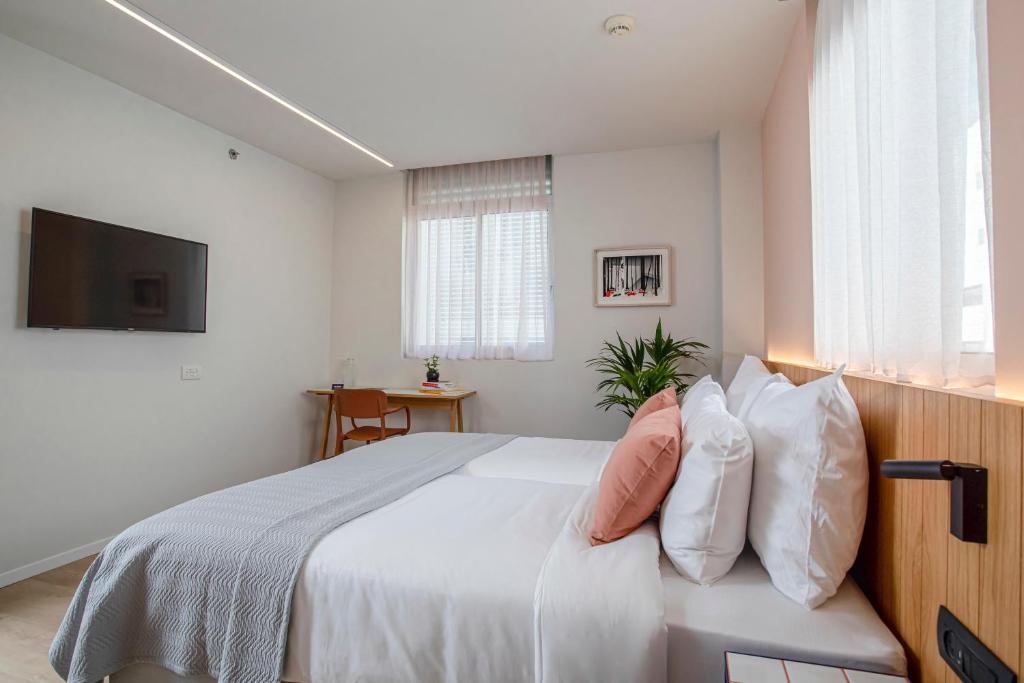 Postel nebo postele na pokoji v ubytování Artist Hotel - an Atlas Boutique Hotel