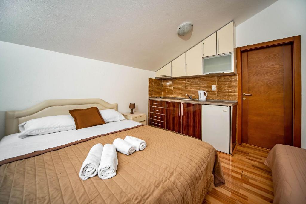 Postel nebo postele na pokoji v ubytování Apartments Marković