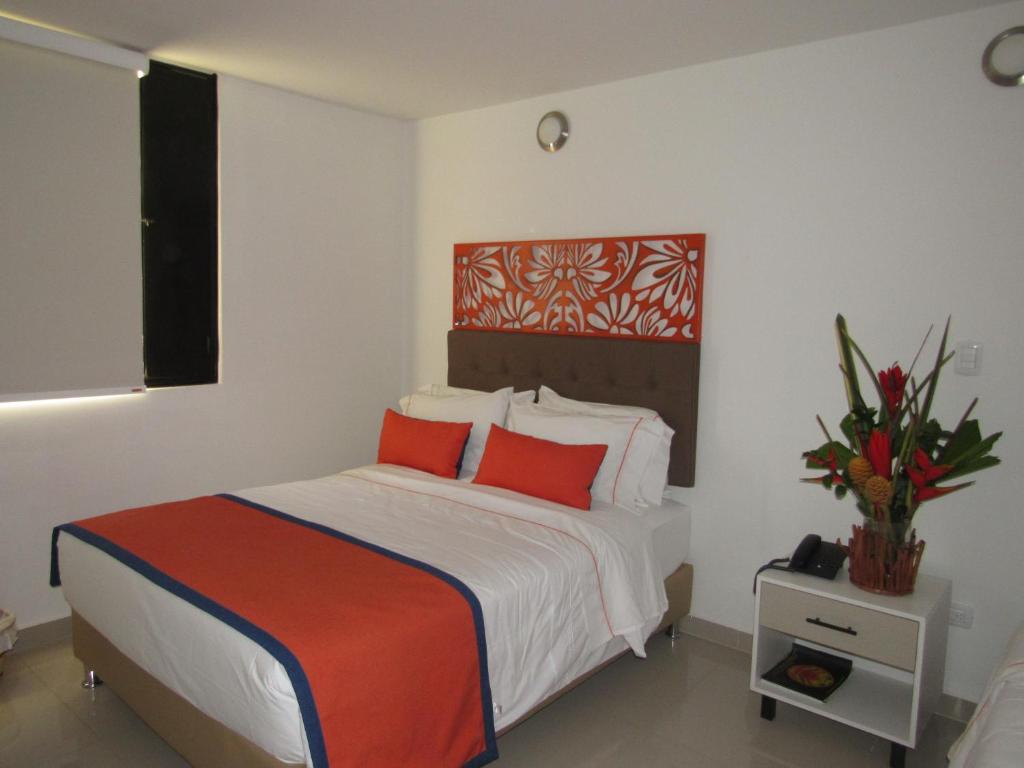 Postel nebo postele na pokoji v ubytování Hotel Yalconia