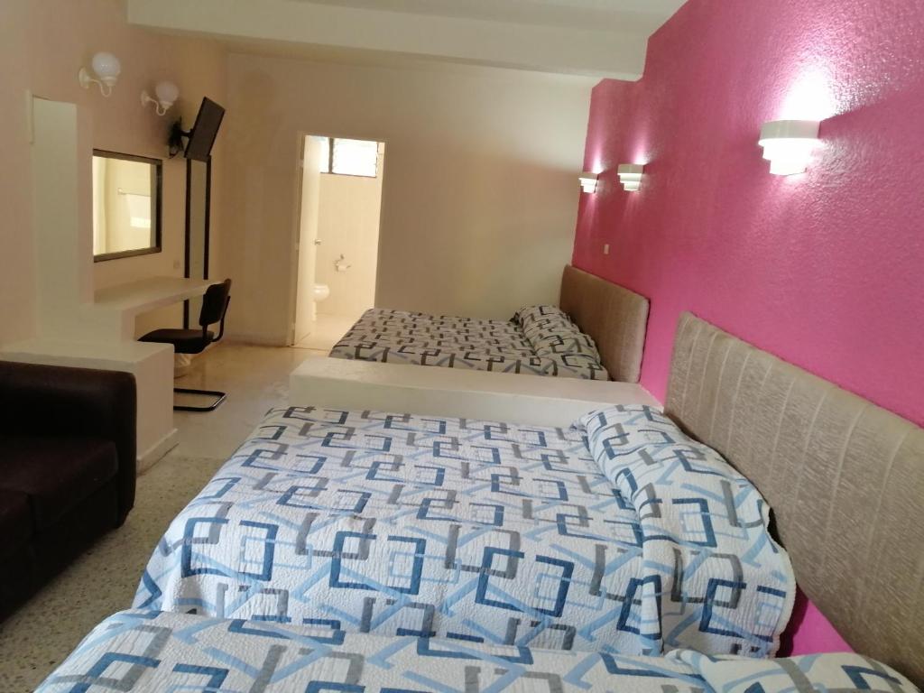 Postel nebo postele na pokoji v ubytování Hotel Tamuin