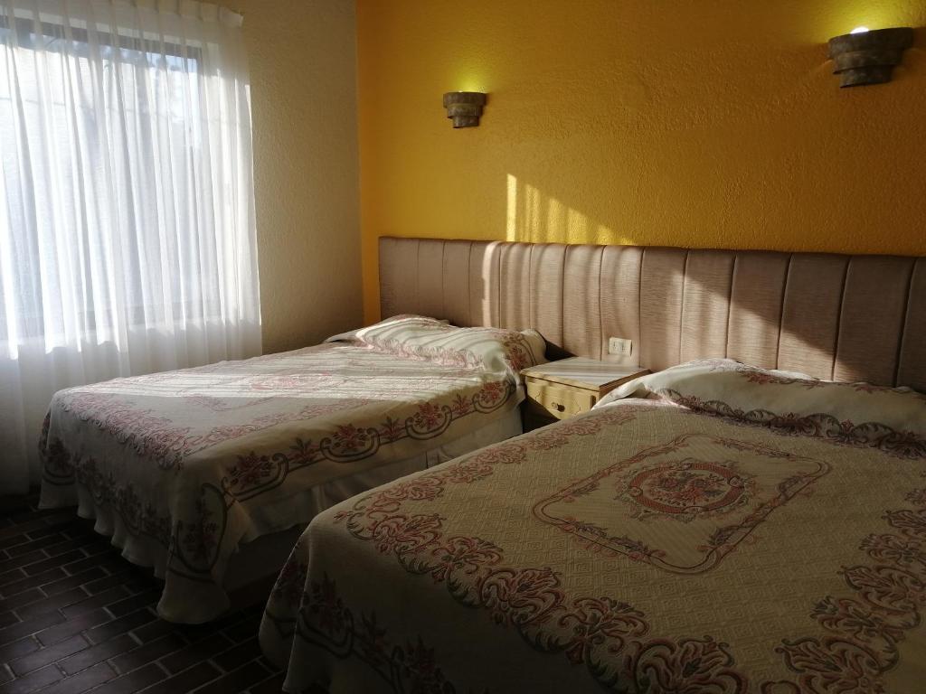 Postel nebo postele na pokoji v ubytování Hotel Tamuin