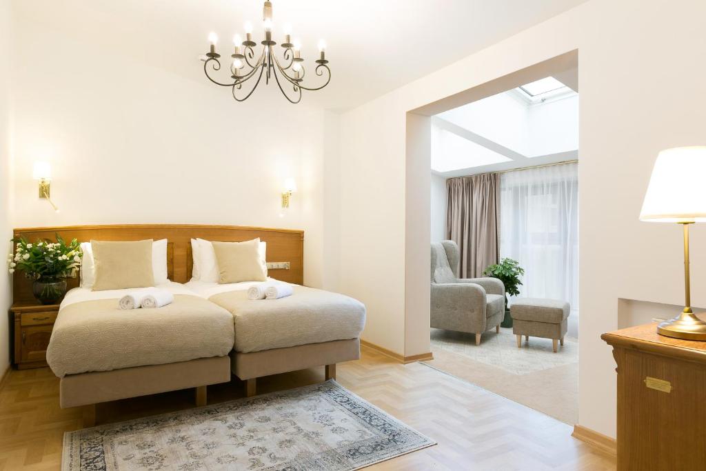 Postel nebo postele na pokoji v ubytování Ventus Rosa Boutique Aparthotel