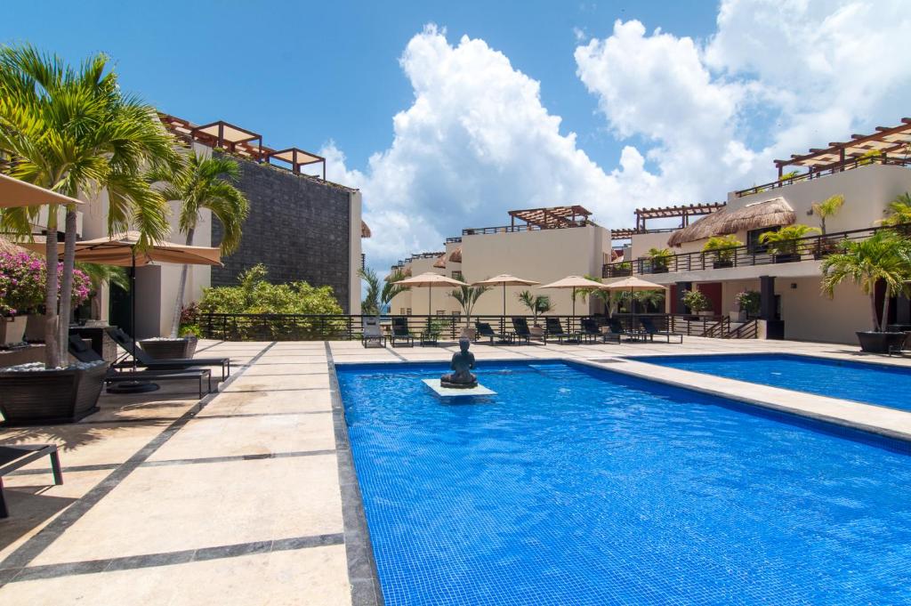 Aldea Thai Beachfront Condo Complex with Resort Pool & Amenities