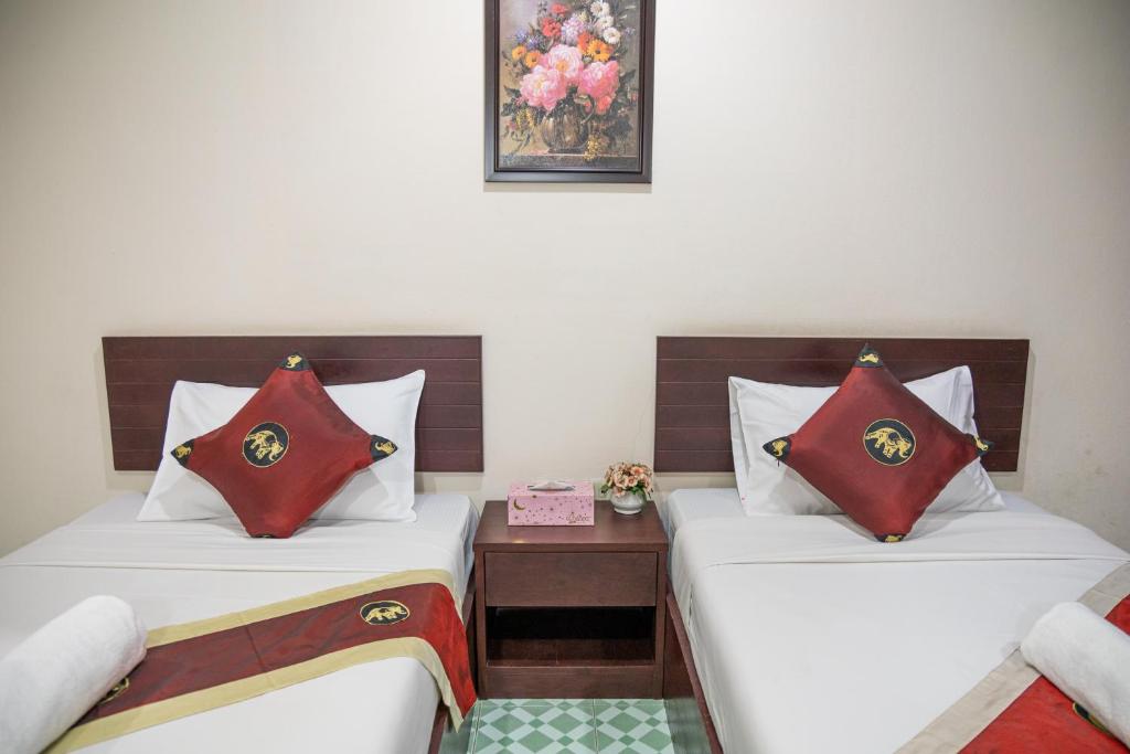 Postel nebo postele na pokoji v ubytování JJ hut hotel