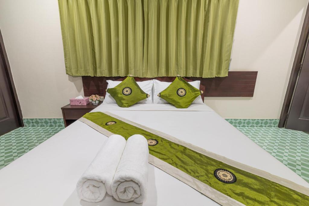 Postel nebo postele na pokoji v ubytování JJ hut hotel